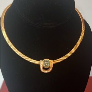 Christian Dior gold-tone choker with faceted crystal and blue gemstone pendant.